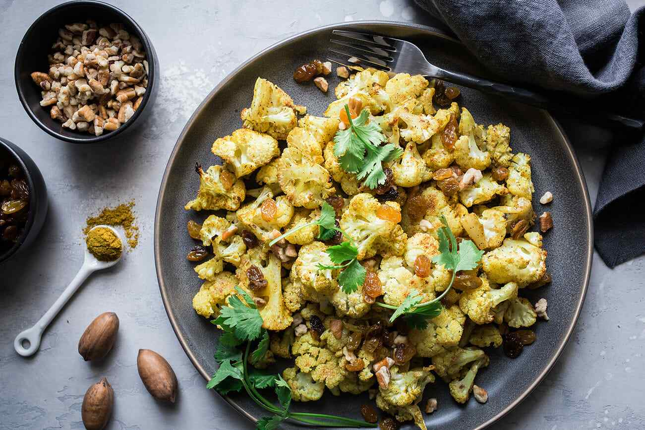 Roasted Curried Cauliflower with Pecans and Golden Raisins